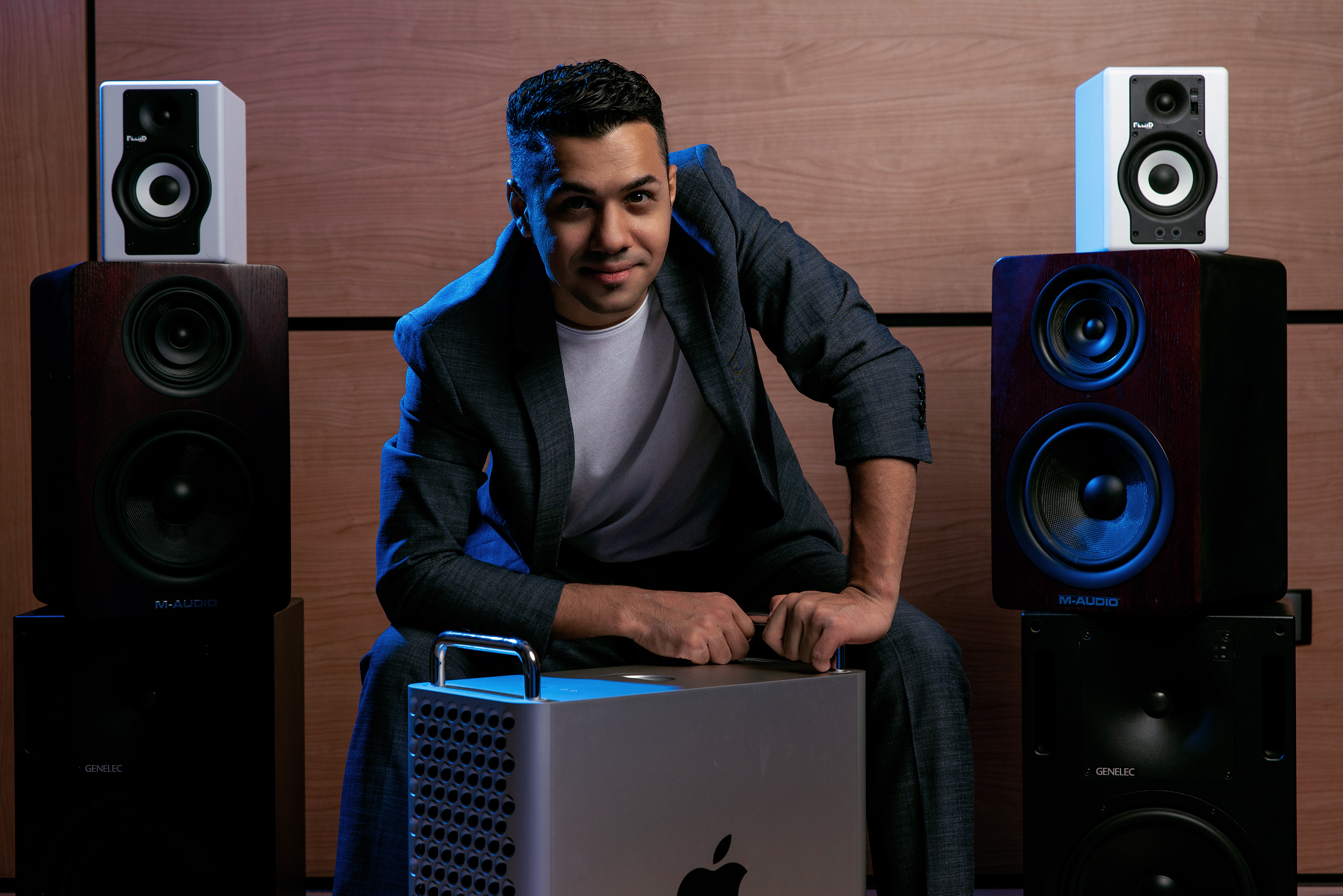 Hussain Alarab in a recording studio between monitor speakers